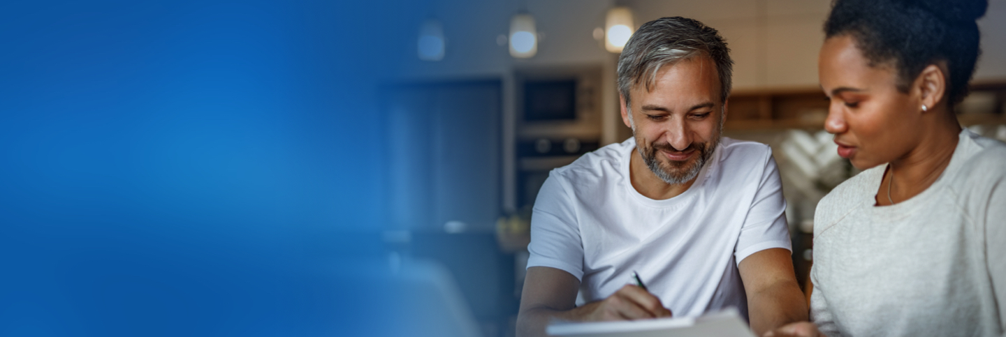 Man helping woman with finances